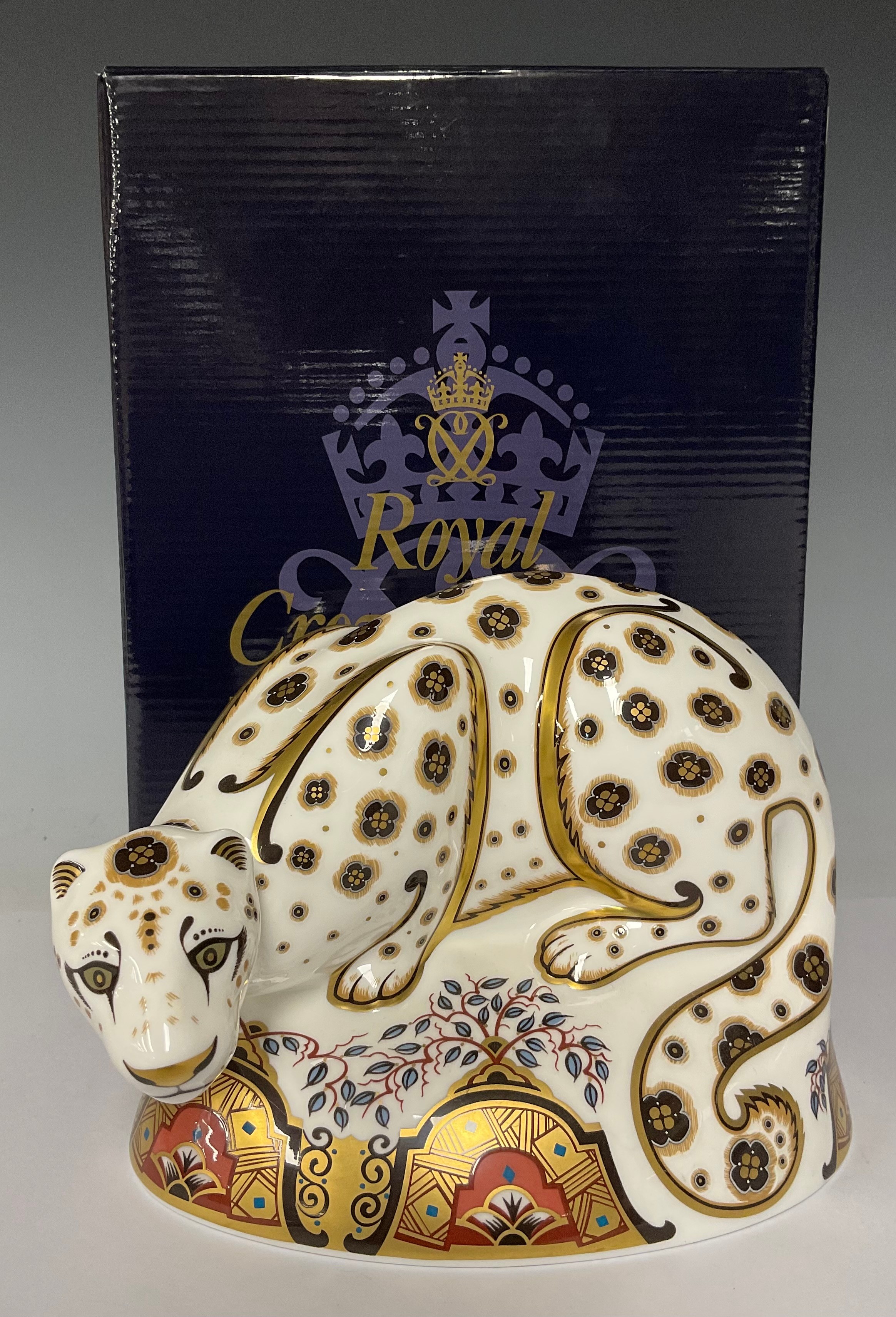 A Royal Crown Derby paperweight, Snow Leopard, gold stopper, 16cm wide, boxed
