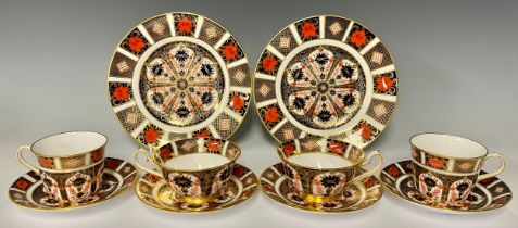 A pair of Royal Crown Derby Imari palette 1128 pattern teacups and saucers, first quality; another