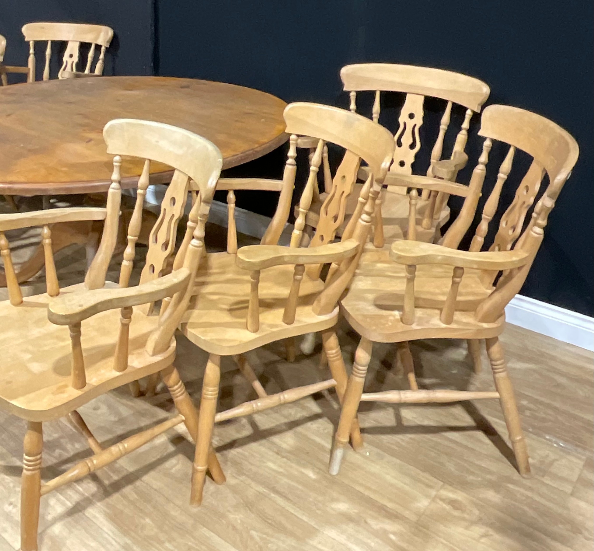 A farmhouse pine circular dining table, 72cm high, 151.5cm diameter; a set of seven beech carver - Image 2 of 3