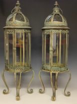 A pair of large verdigris brass lanterns or indoor greenhouse cloches, each 82cm high