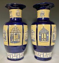 Ceramics - a pair of contemporary glazed baluster vases, decorated with six panels, each with a
