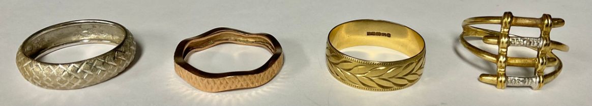 A 9ct gold QVC fashion ring, of modernist design, size V, marked 375, 2.4g; three other 9ct gold