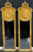 A pair of contemporary Italian Baroque style gilt wall hanging mirrors, each with interlaced foliate