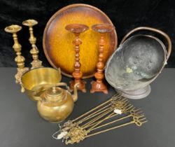 A Victorian copper coal scuttle; a pair of brass pricket candlesticks, cast with lion masks, 42cm