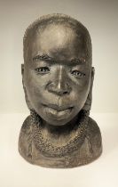 Tribal Art & the Eclectic Interior - an African terracotta head, inscribed FLORA to verso, 20.5cm