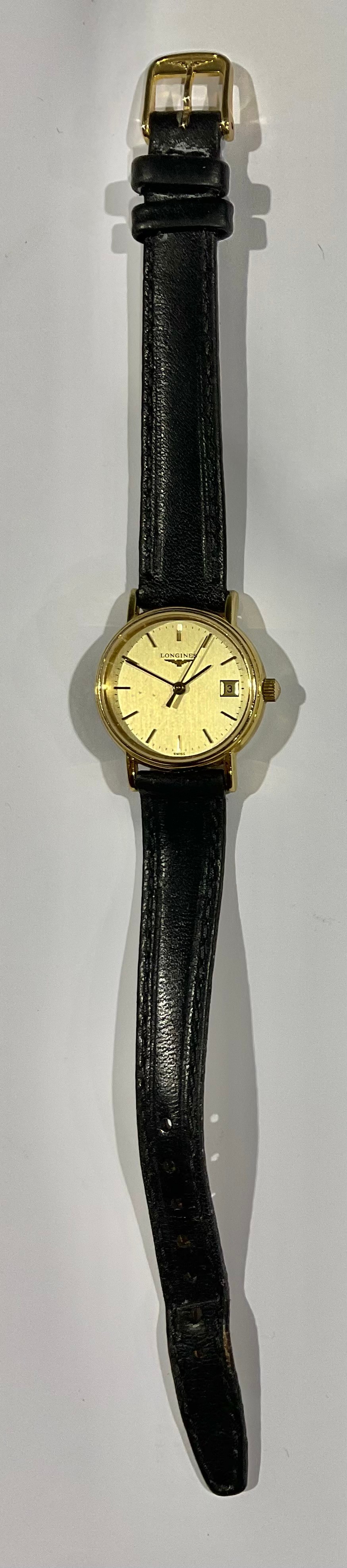 A lady's Longines gold plated stainless steel watch, Champagne dial, baton indicators, centre