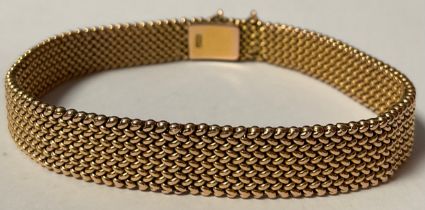 A 15ct gold mesh link bracelet, the clasp with safety chain, marked 15ct, 23.2g