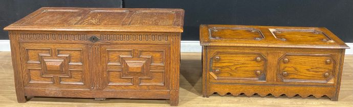 A 17th century style oak blanket chest, 60cm high, 124cm wide, 53.5cm deep; another, 45.5cm high,