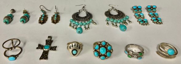 A pair of sterling silver earrings set with polished turquoise cabochons, marked 925 GM, 5cm; a