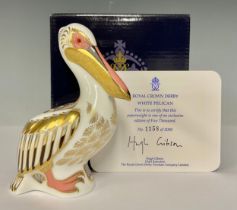 A Royal Crown Derby paperweight, White Pelican, limited edition 1,158/5,000, gold stopper, 13cm, red