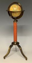 A reproduction miniature desktop globe, with leather bound support, tripod base, 29cm high