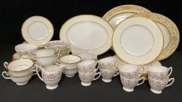 A Wedgwood dinner service for six, cream border, gold rim, comprising dinner plates, dessert plates,