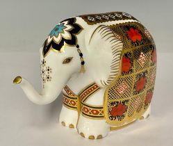 A Royal Crown Derby paperweight, Imari Elephant, trunk raised, printed in the 1128 palette, gold