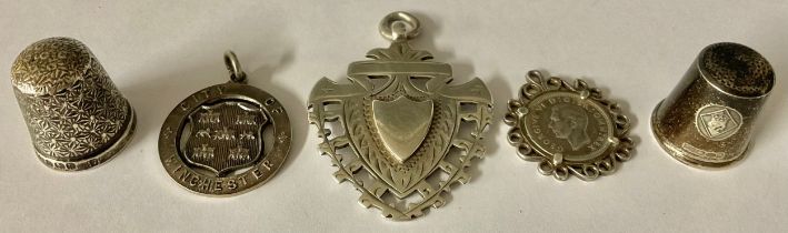 A large hallmarked silver fob, Birmingham 1899; a City of Wincester Swimming medal fob, Birmingham