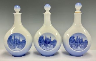 A set of three Royal Copenhagen compressed ovoid bottle vases and covers, printed with Rosenborg