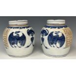 A pair of contemporary Chinese Export ware blue and white ginger jars and covers, each decorated