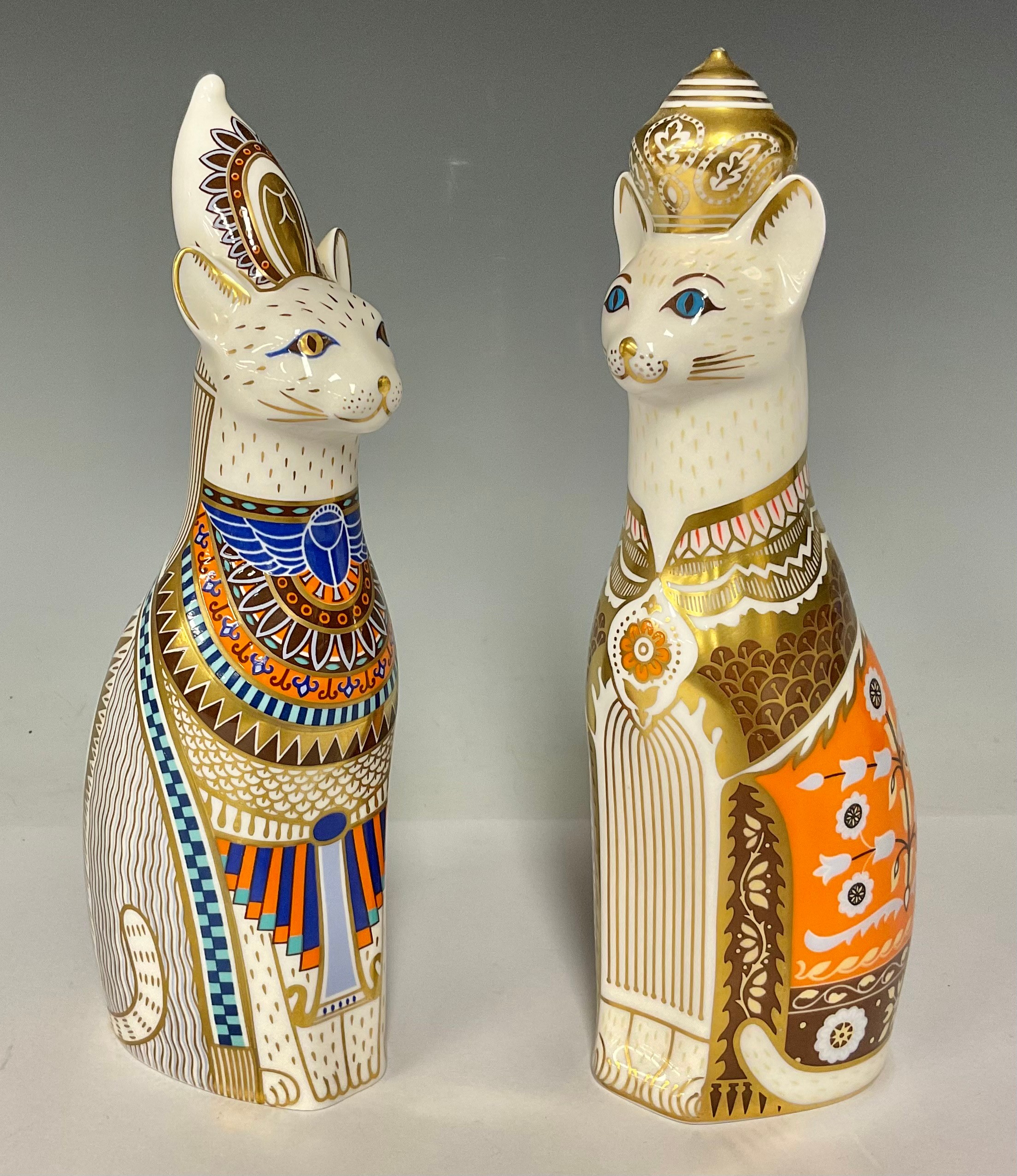 A pair of Royal Crown Derby Royal cat models, Egyptian and Siamese, 22cm, printed marks in red,