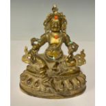 A gilt metal model of a Deity, inset with coral and turquoise, 12.5cm high