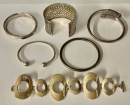 A sterling silver cuff bracelet, marked 925; a Kevin Oliver silver hoop bracelet, marked 925; four