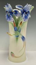 A Franz porcelain vase, moulded in relief with blue orchids and drinking hummingbird, number