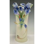 A Franz porcelain vase, moulded in relief with blue orchids and drinking hummingbird, number