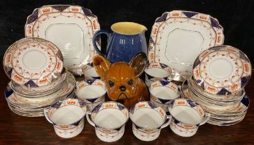 A Denby Ware Bourne Denby Byngo Dog, brown glaze; a Denby 2½ pint blue glaze jug and a Warwick China