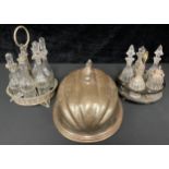 Plated ware - a Victorian papier-mâché cruet, silver tops; a seven bottle cruet with James Dixon &