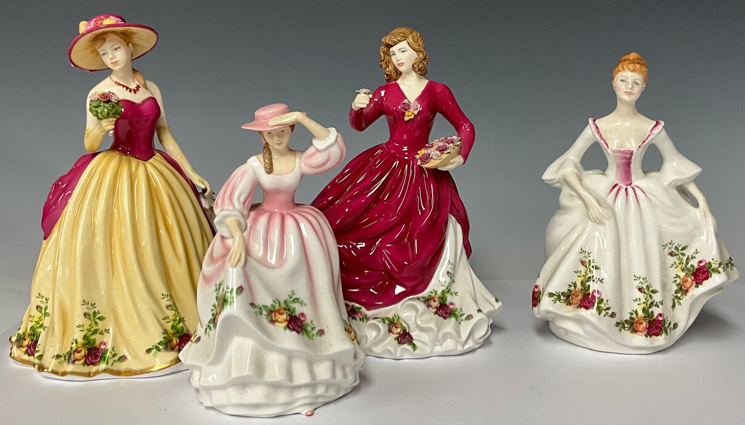 A Royal Doulton HN3221 Country Rose figurine, unboxed; a Royal Doulton Spring Bloom figurine,