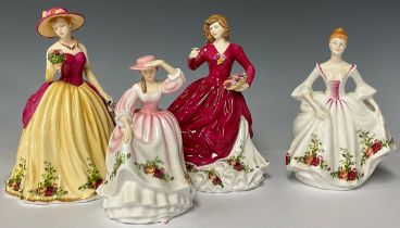 A Royal Doulton HN3221 Country Rose figurine, unboxed; a Royal Doulton Spring Bloom figurine,