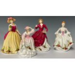 A Royal Doulton HN3221 Country Rose figurine, unboxed; a Royal Doulton Spring Bloom figurine,