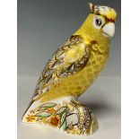 A Royal Crown Derby paperweight, Citron Cockatoo, gold stopper, 13cm high, red printed marks and