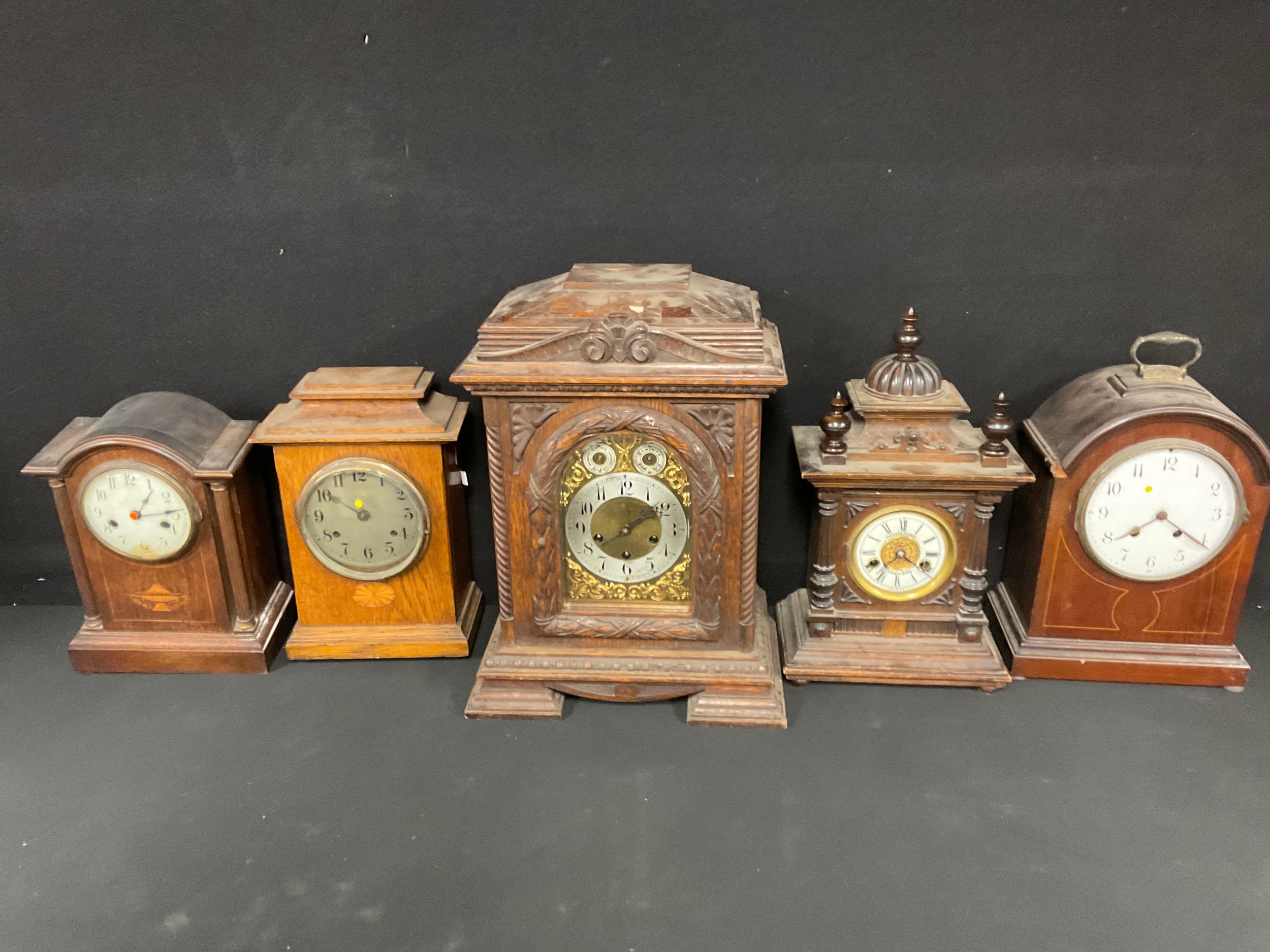 Clocks - a late 19th/eary 20th century oak bracket type mantel clock, 48cm high; a W.E. Watts,