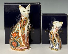 A Royal Crown Derby paperweight, Siamese Cat, gold stopper, boxed; another, Siamese Kitten, gold