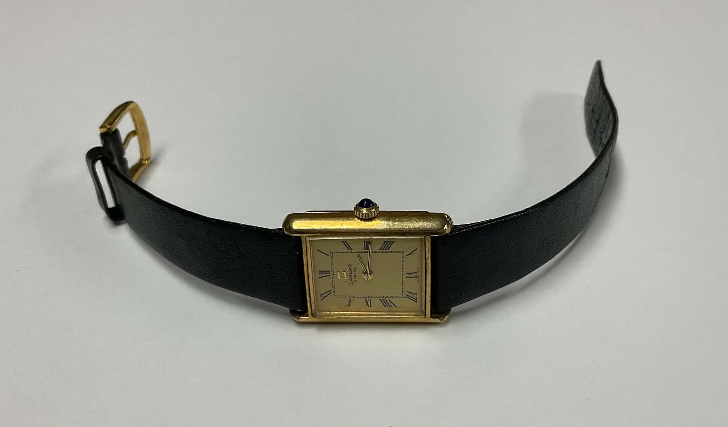 A lady's Sarcar Geneve gold plated watch, rectangular Champagne dial, Roman numerals, the winder set