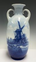 A Rosenthal porcelain two handled ovoid vase, printed in blue and white with a river, barges and