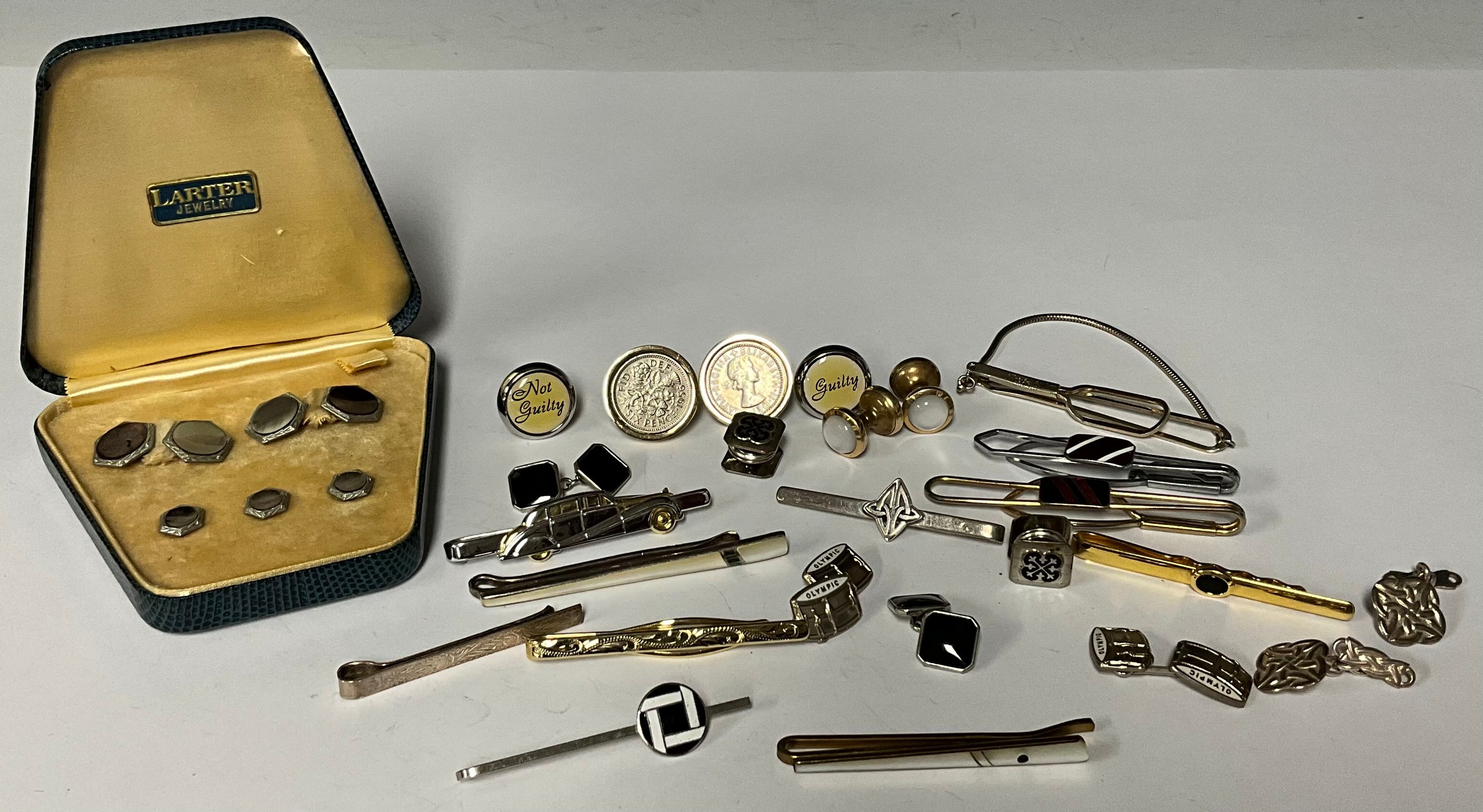 A suite of cuff links and collar studs, cased; a sterling silver tie clip; other tie clips; a pair