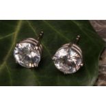A large pair white stone stud earrings, the round brilliant cut stones possibly tourmaline, 9mm in