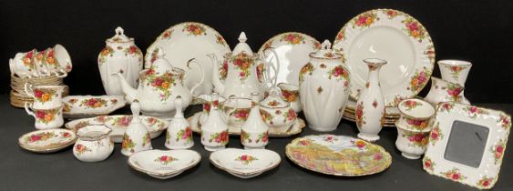 A Royal Albert Old Country Roses pattern teapot, coffee pot, pair of slender ovoid ginger jars and