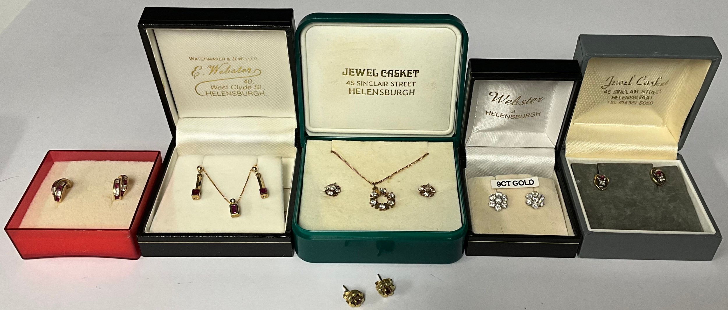 A 9ct gold necklace and earring suite, set with clear clusters of stones, marked 375, 3.3g, boxed; a