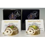 A pair of Royal Crown Derby paperweights, Primrose Spring Hedgehog and Strawberry Summer Hedgehog,