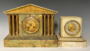 An early 20th century onyx architectural mantel clock, Roman numerals on circular dial, flanked on