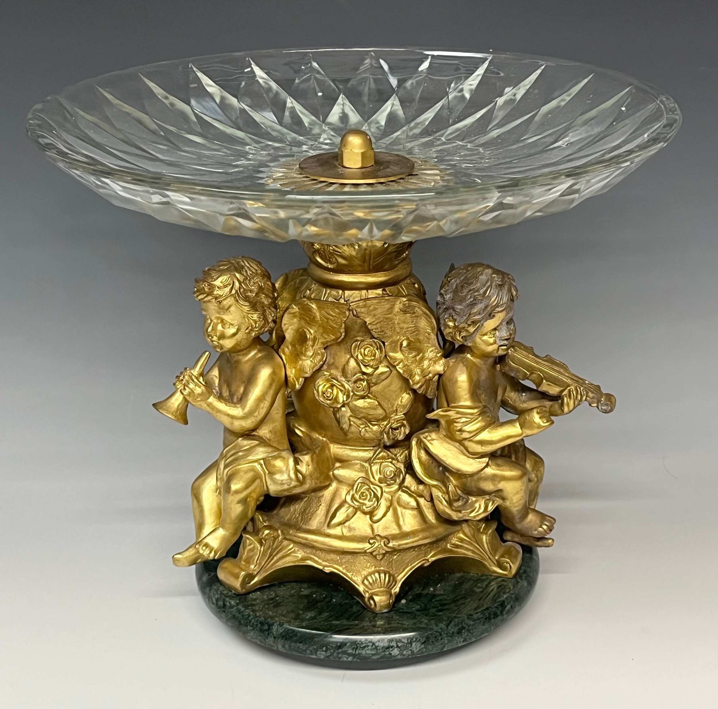 A reproduction 19th century style table centre, the gilt metal support cast as a pair of cherub - Image 2 of 3