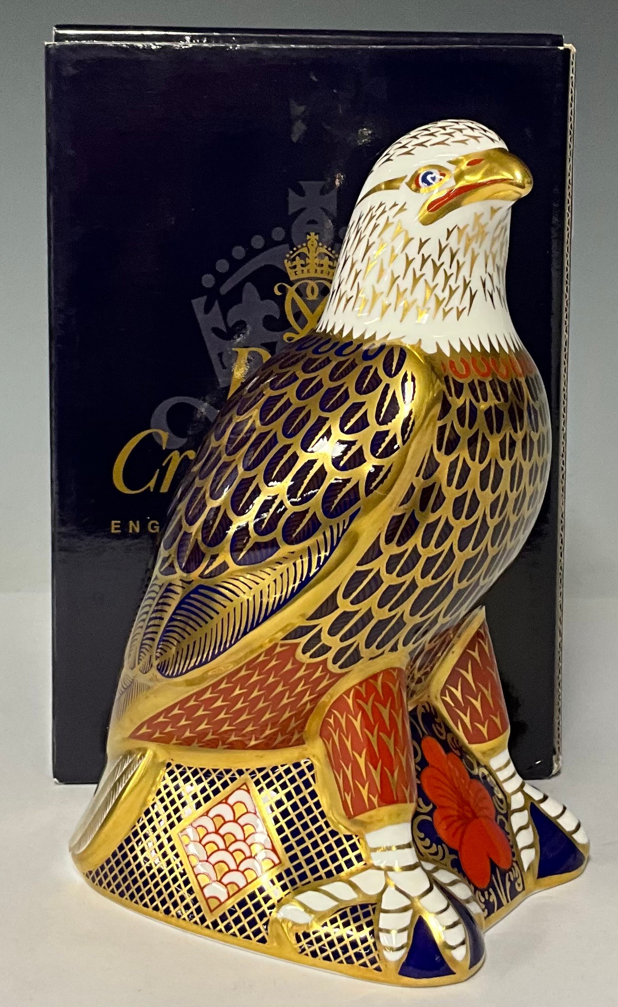 A Royal Crown Derby paperweight, Bald Eagle, gold stopper, 18cm high, printed marks in red, boxed