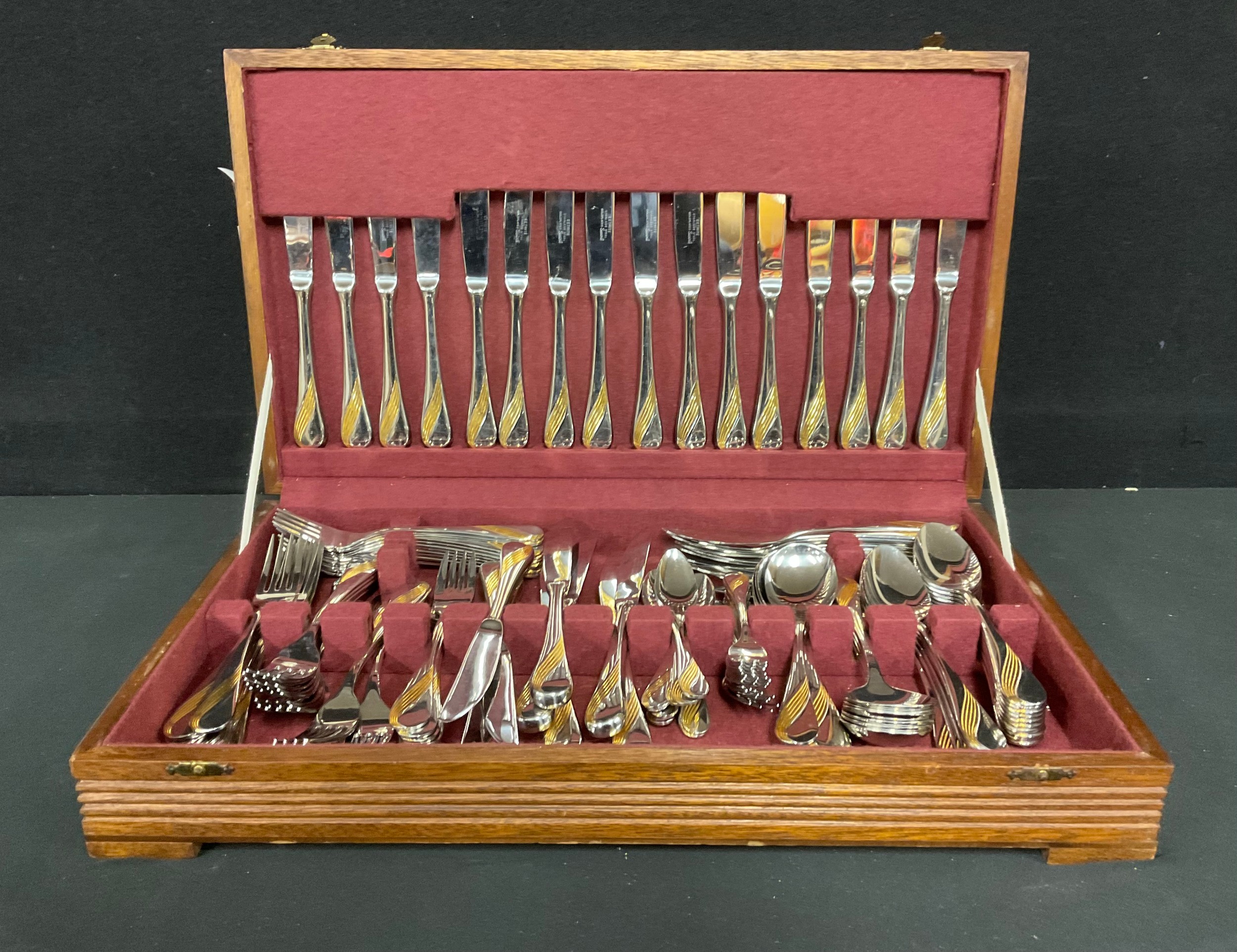 A German Eetrite gold plated stainless steel flatware set, in canteen case