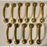 Architectural Salvage - eleven curved brass door handles