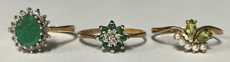 A 9ct gold emerald and diamond cluster ring, size N/O, marked 375, 2g, boxed; two other 9ct gold