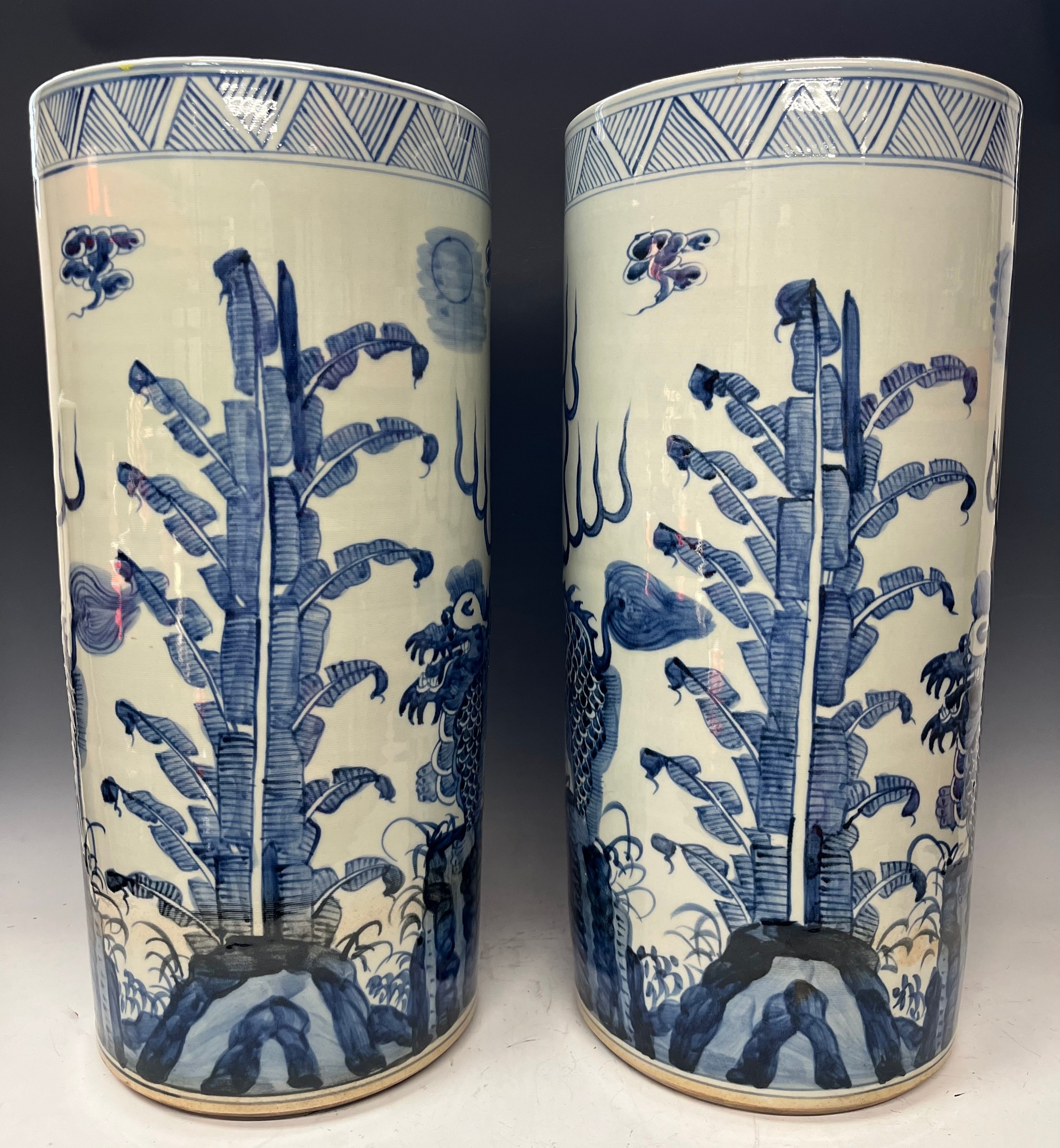 A pair of contemporary blue and white glazed circular floor standing sleeve vases, decorated in - Image 2 of 2