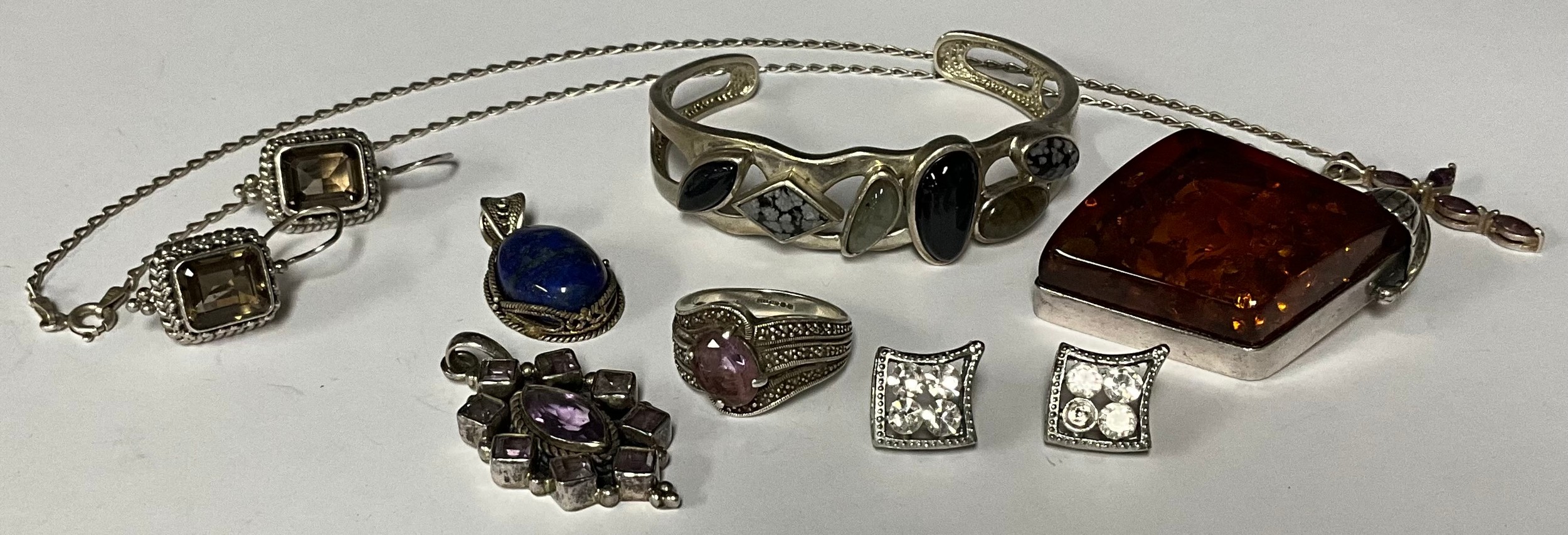 A sterling silver cuff bracelet, set with polished semi-precious stones, marked 925; other similar