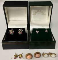 A pair of 9ct gold ruby and diamond chip earrings, marked 9ct, 0.7g, boxed; a pair of 9ct gold