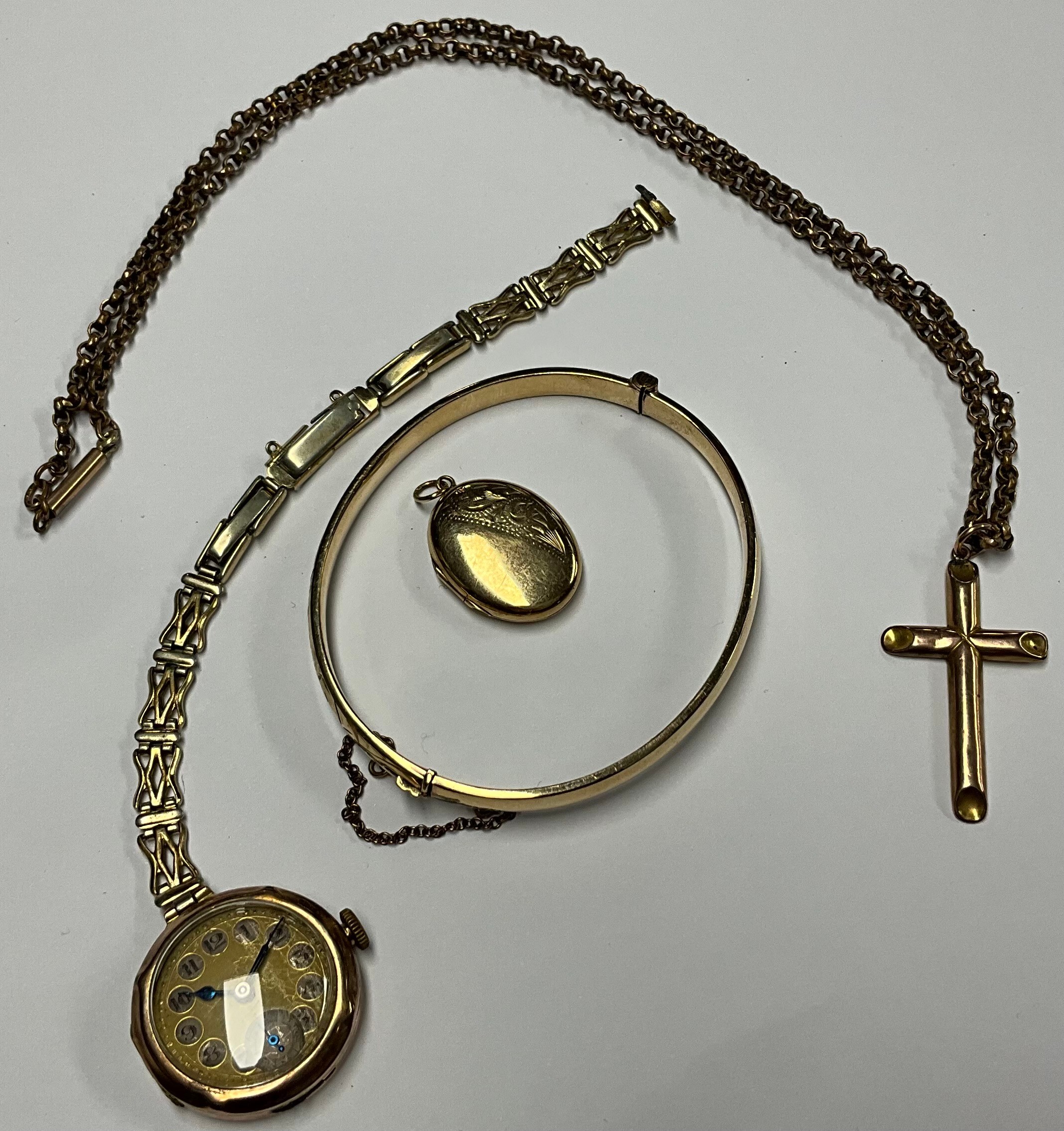 A 9ct rose gold cross pendant, marked 375, suspended from a 19th century gold plated guard chain